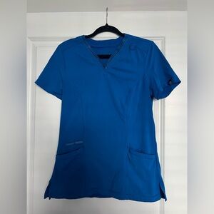 Urbane woman’s blue v neck scrub top